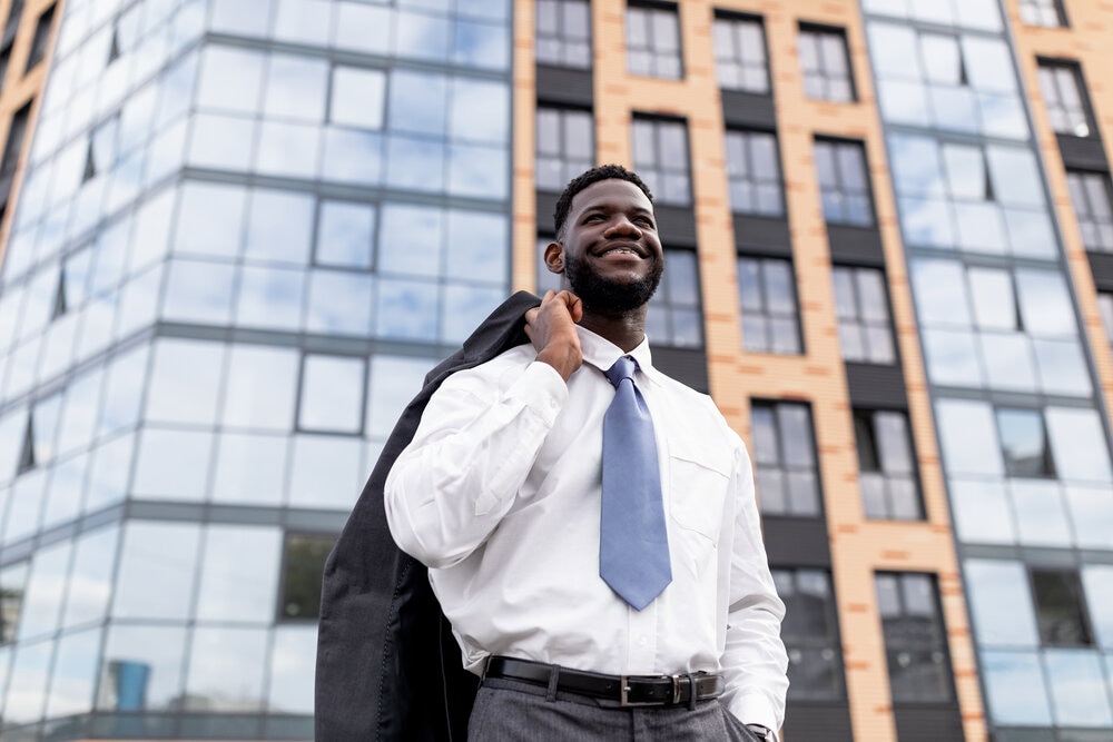 happy-african-american-businessman-leaving-office